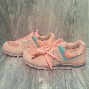 New Balance sneakers in baby pink and blue color way.